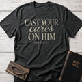 Cast Your Cares on Him Christian t-shirt in Dark Heather — 1 Peter 5:7