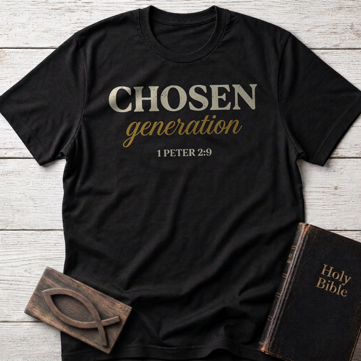 Chosen Generation t-shirt in Black — 1 Peter 2:9 Christian tee flat lay with Holy Bible and ichthys on whitewashed wood