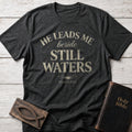 He Leads Me Beside Still Waters Christian t-shirt in Dark Heather — Psalm 23:2