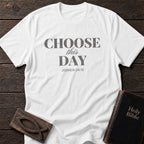 Choose This Day t-shirt in White — Joshua 24:15 Christian tee flat lay with Holy Bible and ichthys on dark wood