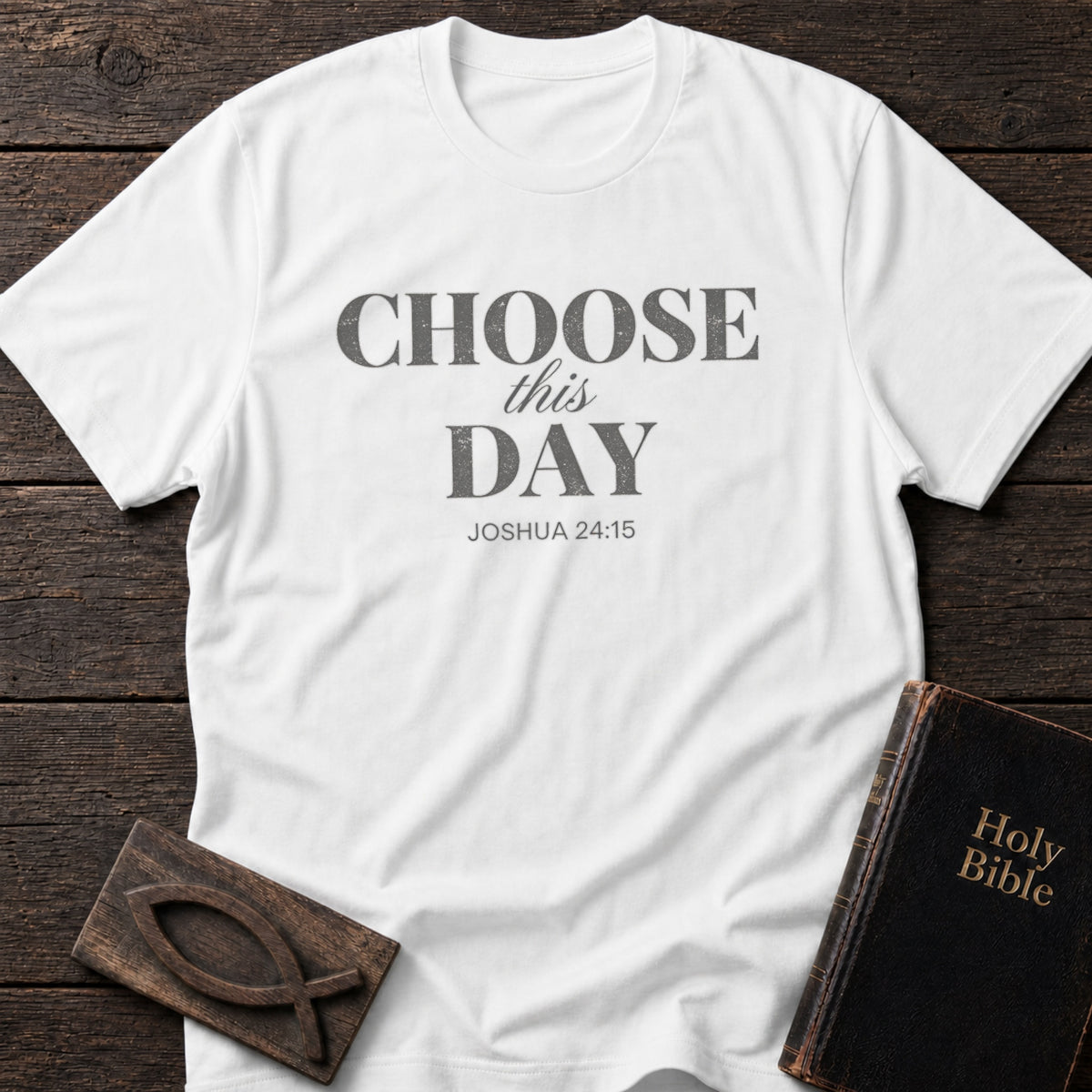 Choose This Day t-shirt in White — Joshua 24:15 Christian tee flat lay with Holy Bible and ichthys on dark wood