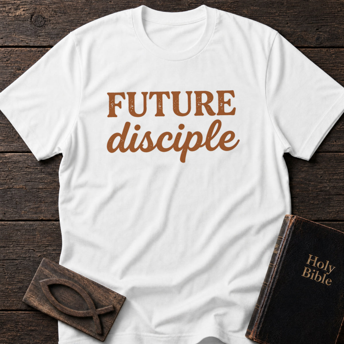 Future Disciple t-shirt in White — Christian tee flat lay with Holy Bible and ichthys on dark wood