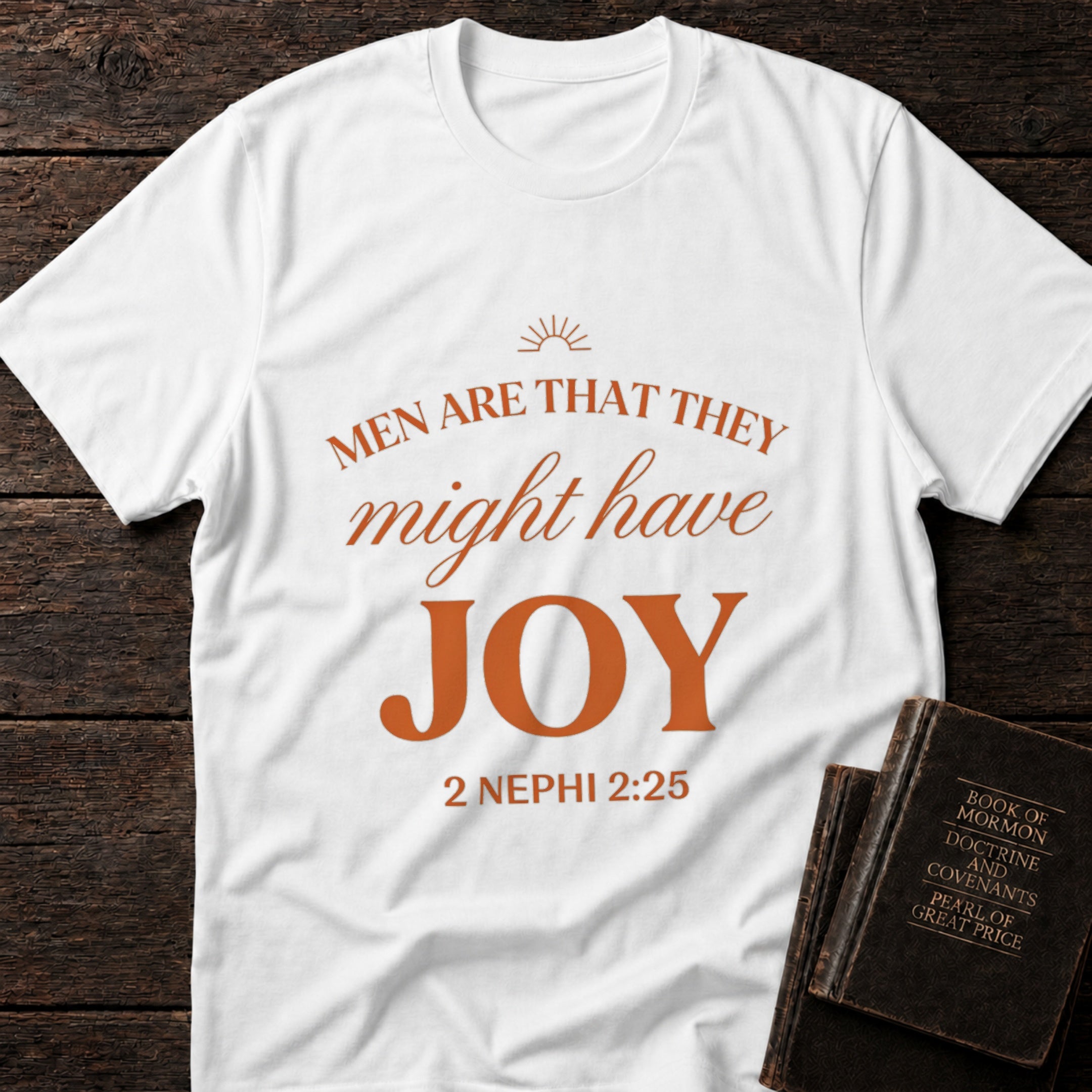 Men Are That They Might Have Joy t-shirt in White — 2 Nephi 2:25 Christian tee flat lay with Book of Mormon scripture set on dark wood