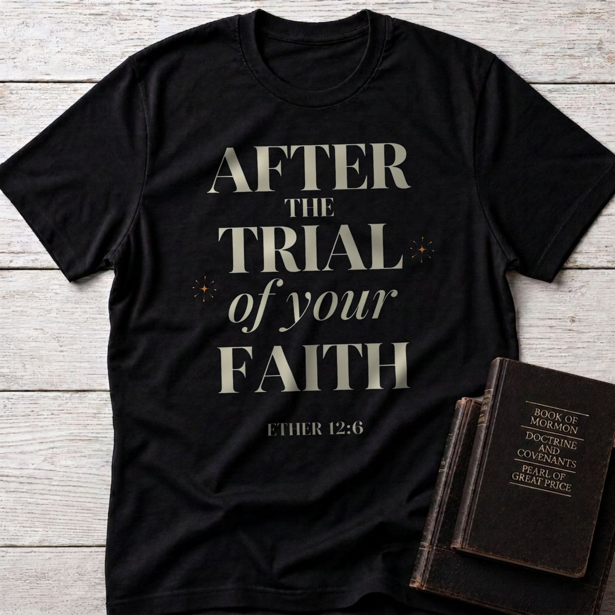 After the Trial of Your Faith t-shirt in Black — Ether 12:6 Christian tee flat lay with Book of Mormon scripture set on whitewashed wood