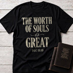 The Worth of Souls Is Great t-shirt in Black — D&C 18:10 Christian tee flat lay with Book of Mormon scripture set on whitewashed wood