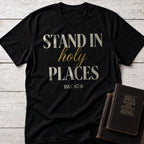 Stand in Holy Places t-shirt in Black — D&C 87:8 Christian tee flat lay with Book of Mormon scripture set on whitewashed wood